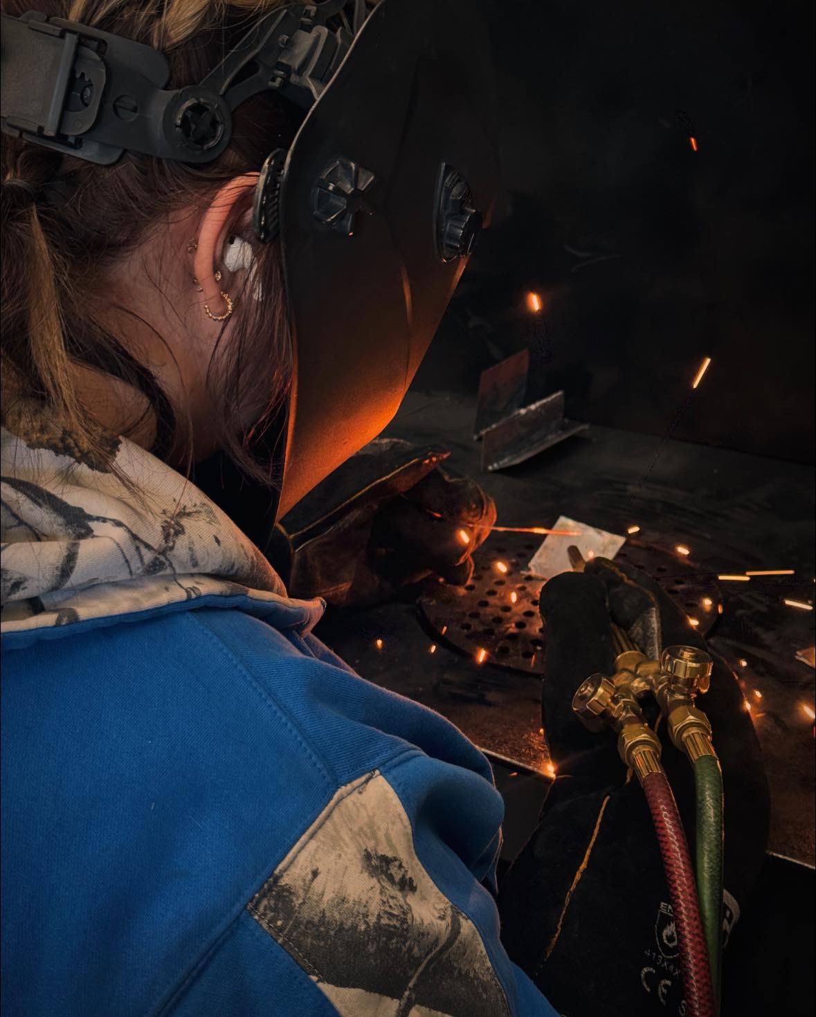 A hospital room scene, a medical professional places a stethoscope on the chest of a patient or medical mannequin in a hos...